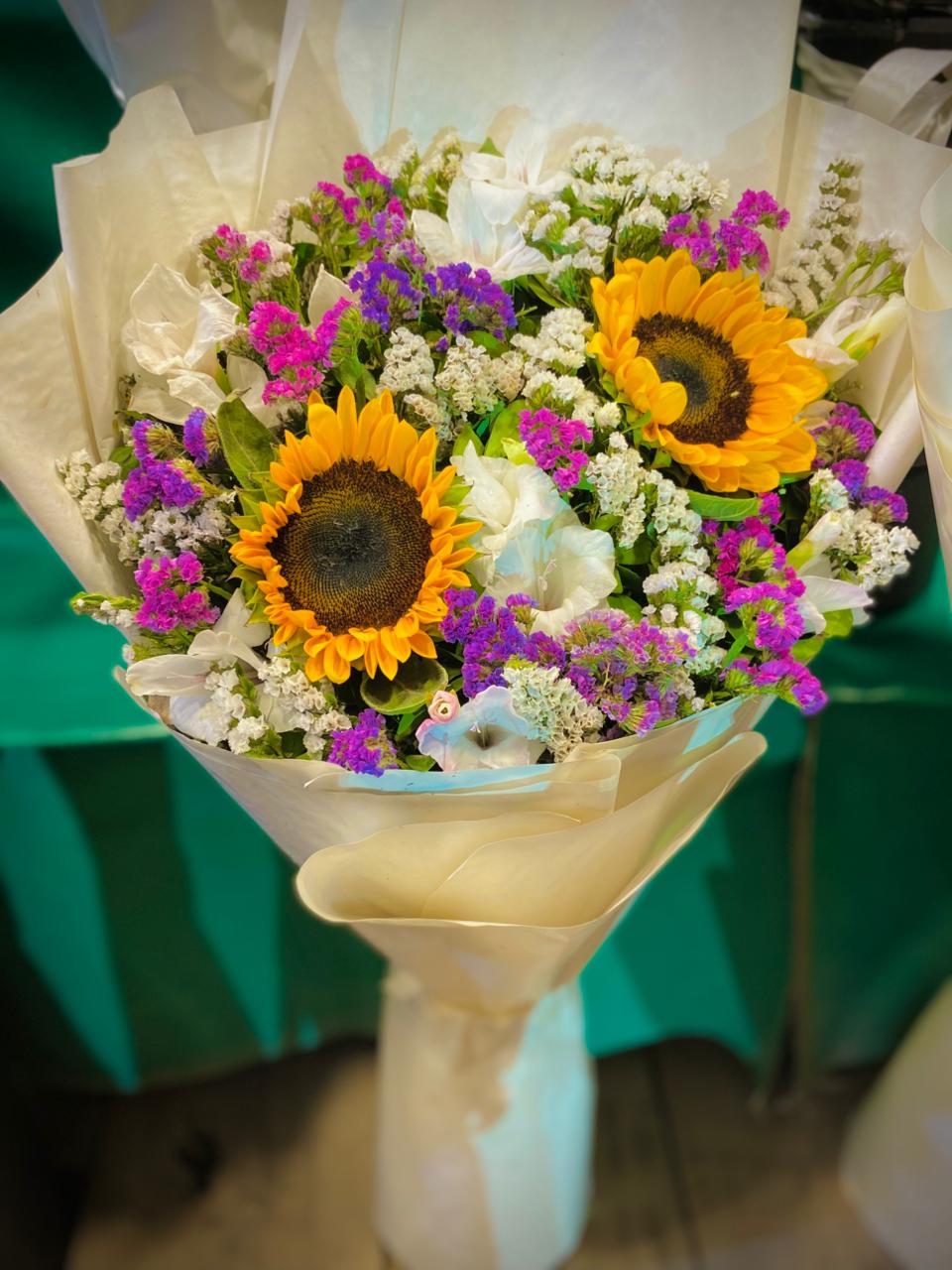 Sun Flower, White Gladiolus & Multiple colored Statice